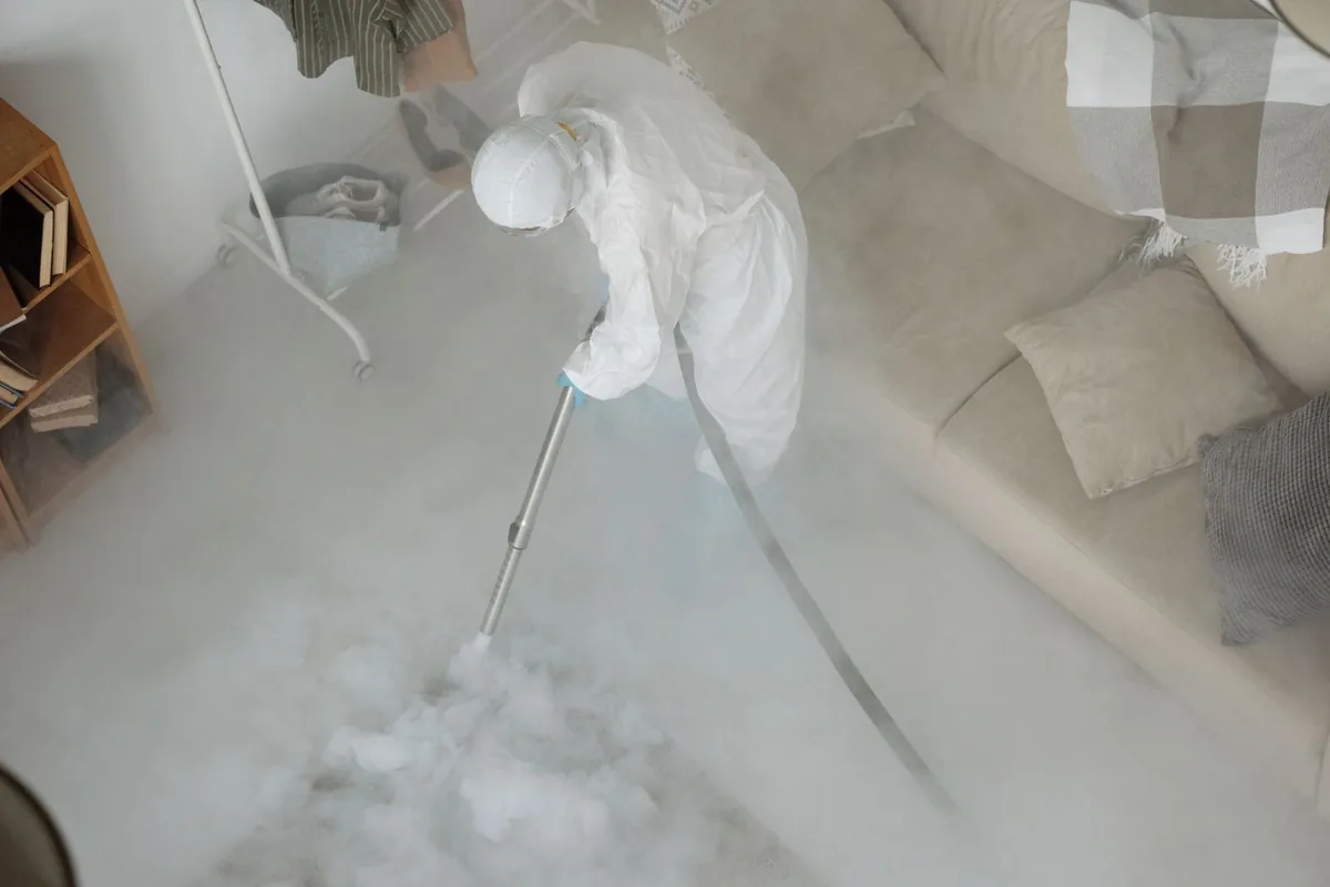 Biohazard cleanup technician in protective equipment, Ixonia, WI